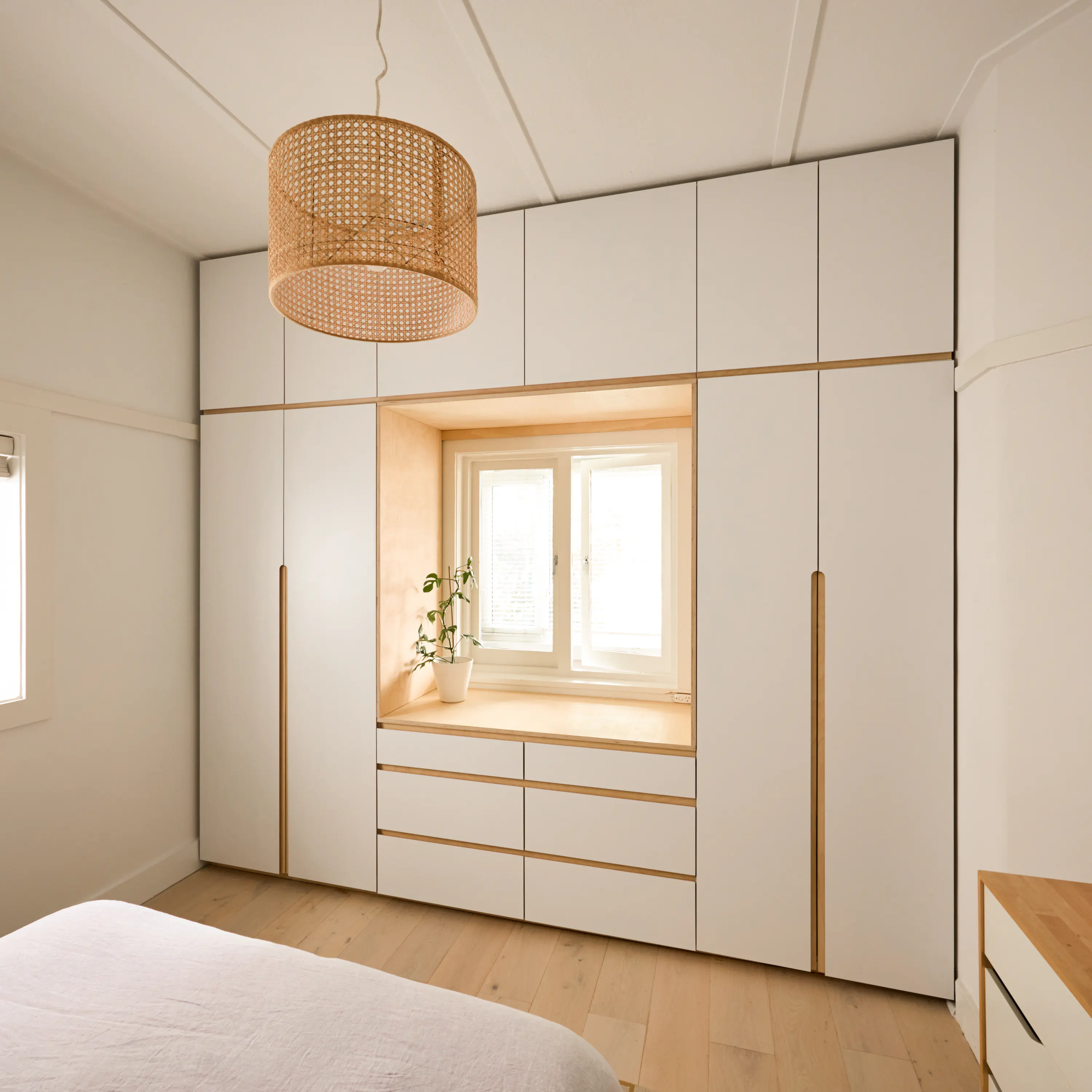 Custom wardrobe with elegant wooden finish and organized shelves