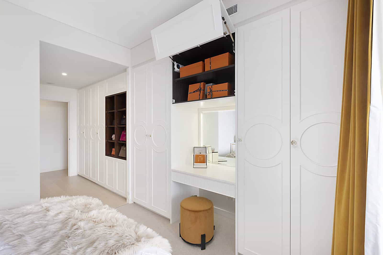 Modern wardrobe renovation with sliding doors and built-in lighting